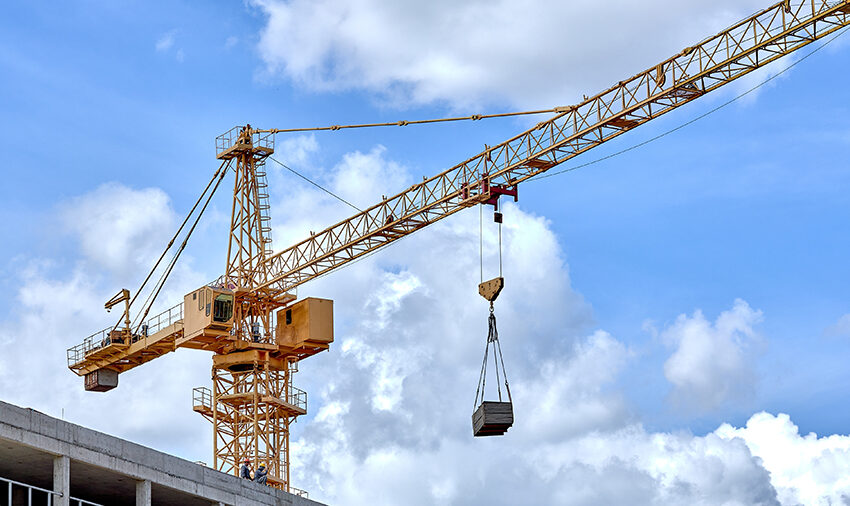 Construction,Crane,On,A,Blue,Sky,Background